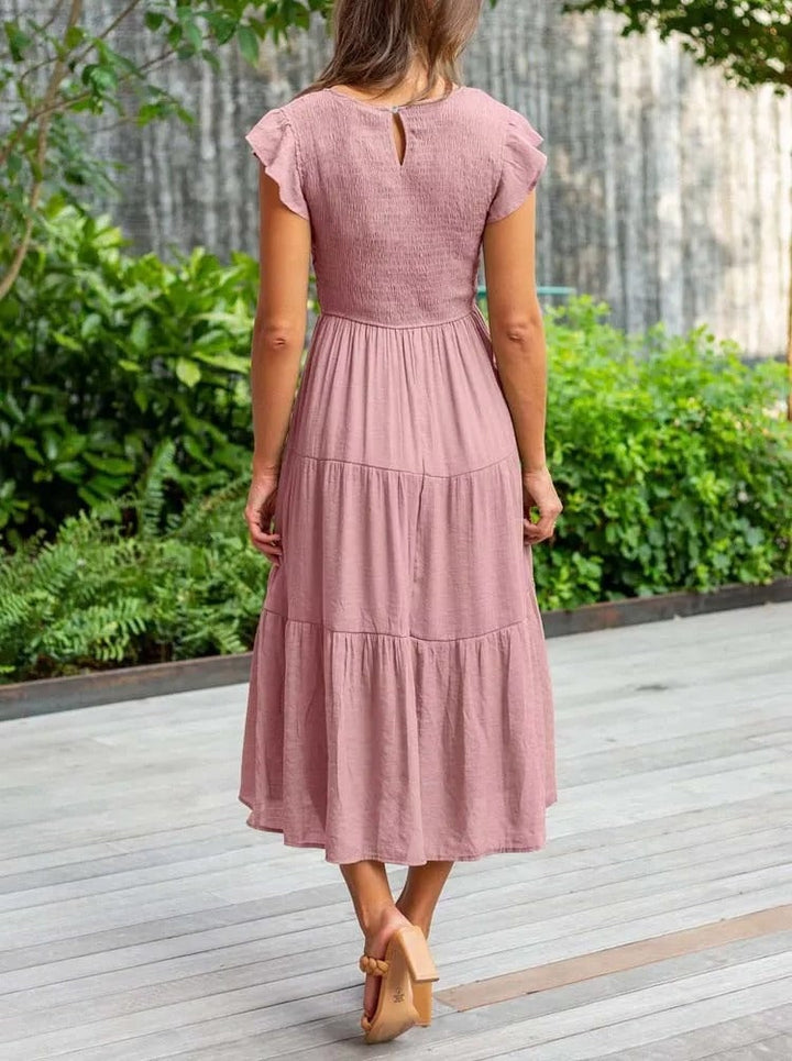 Full-length front view of the Lisette draped dress in dark green