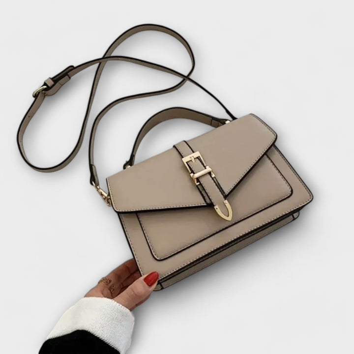 Liv Classic Shoulder Bag in black with elegant buckle hardware and adjustable strap, front view