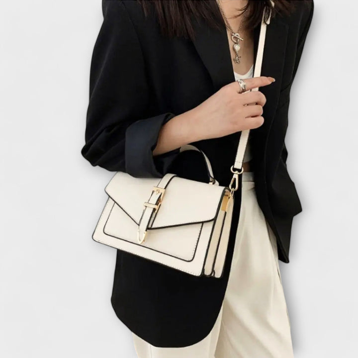 Liv Classic Shoulder Bag in white with refined buckle detail against a clean background