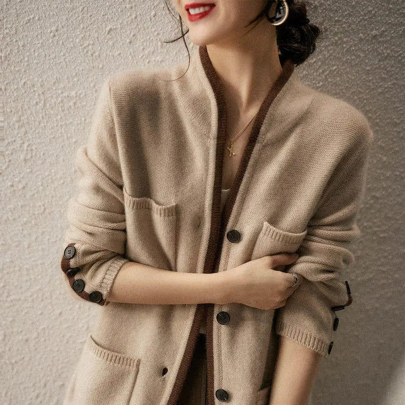 Close-up of the Londyn vintage cardigan in beige showing soft textured fabric and nostalgic detailing
