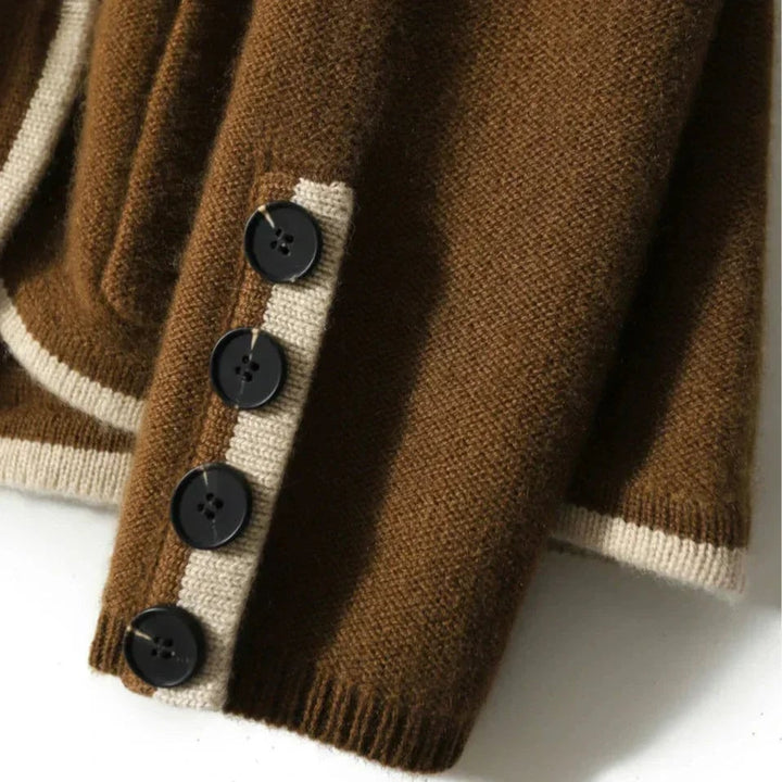 Model smiling in the Londyn vintage cardigan in brown styled for a casual weekend look