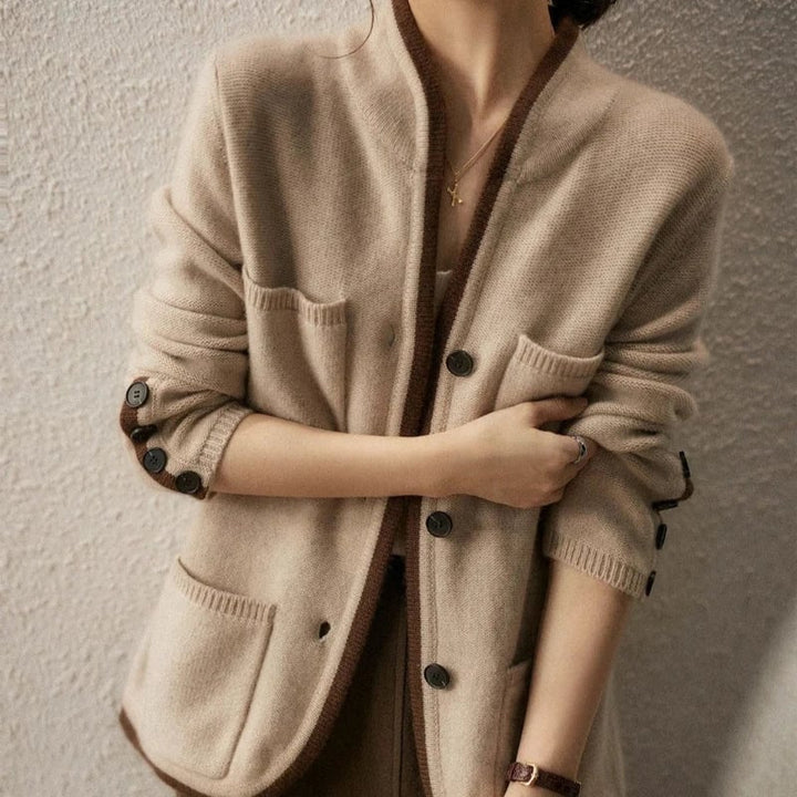 Lifestyle shot of the Londyn vintage cardigan in brown styled for a polished casual autumn outfit