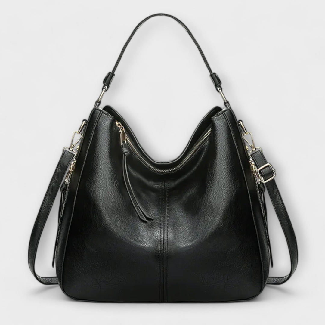 Lora shoulder bag in brown laid flat showing full exterior design