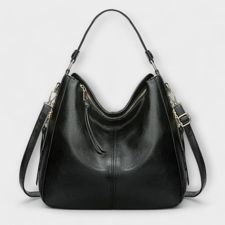 Lora shoulder bag in brown laid flat showing full exterior design