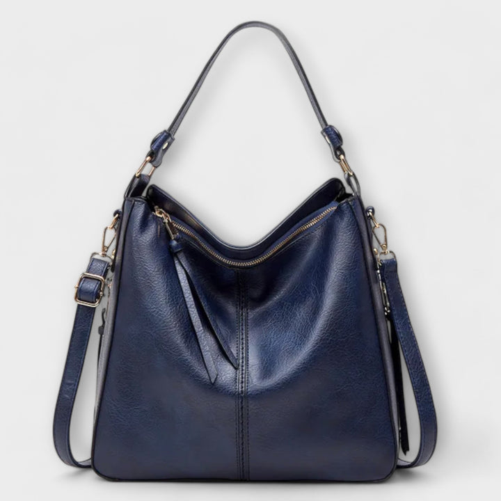 Detail shot of adjustable strap on Lora shoulder bag in gray