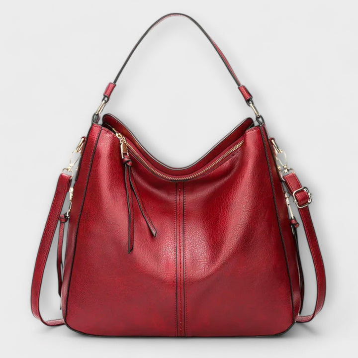 Top-down view of Lora shoulder bag in blue with compartments visible