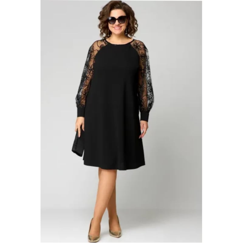 Side view of the Loretta lace dress showing the subtle sleeve split detail and tailored shape