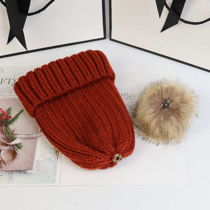 Front view of the Lorette knit beanie in black on a female model