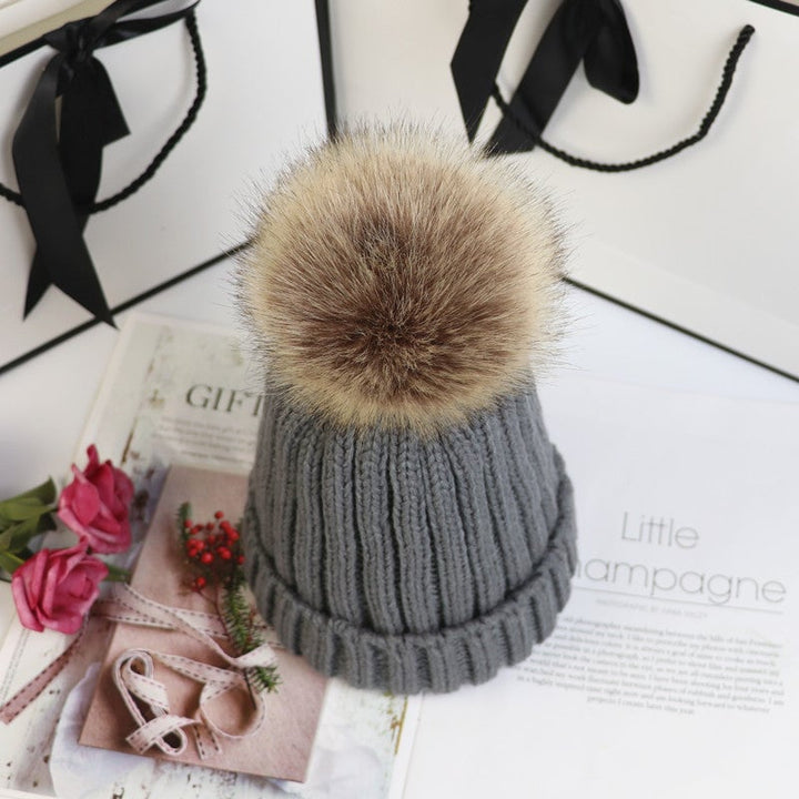 Lorette pom beanie in khaki and black side by side color comparison