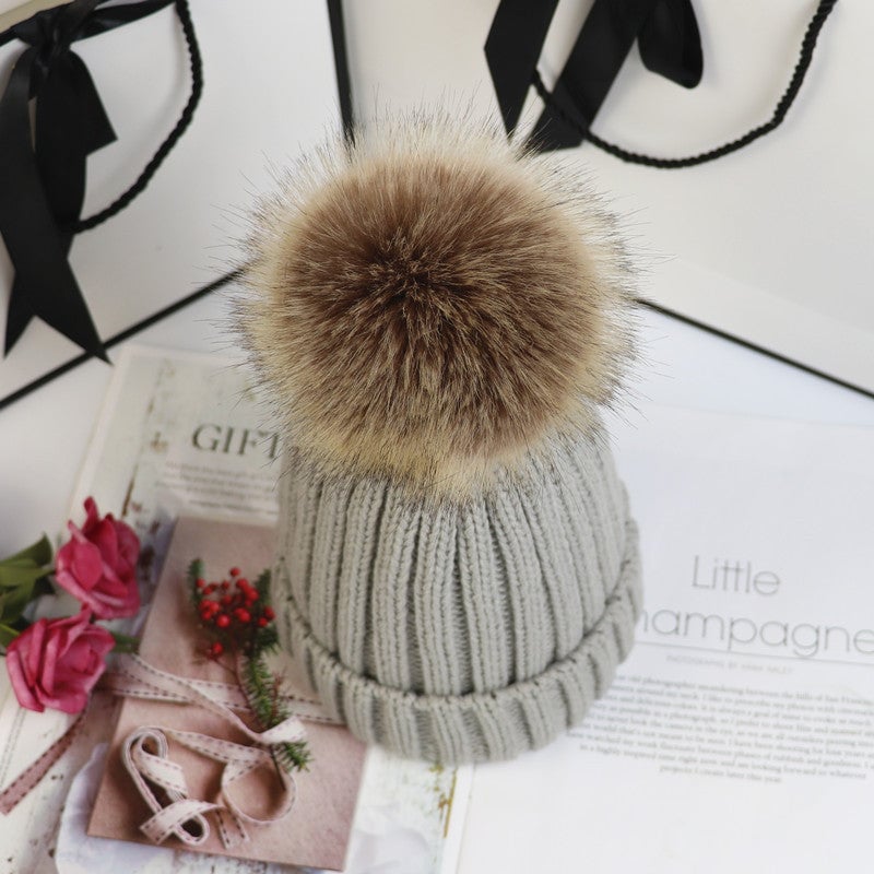 Flat-lay of all eight Lorette beanie color options arranged in a row