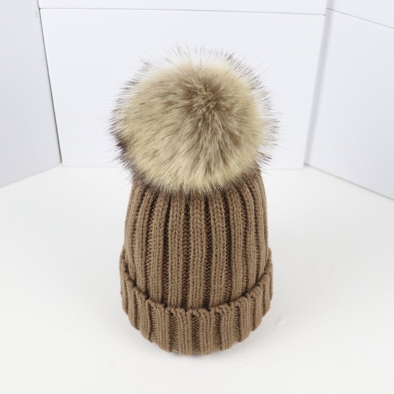 Lorette beanie in brown worn outdoors in a snowy setting