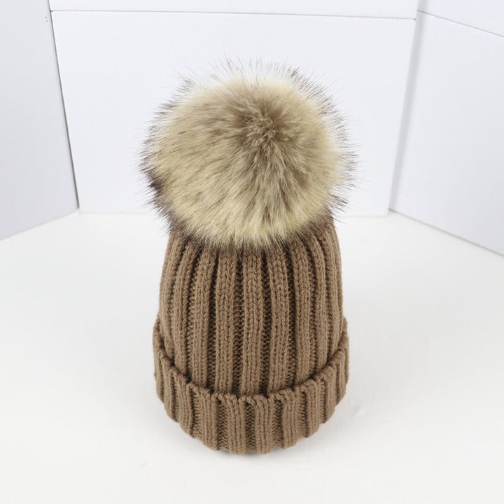 Lorette beanie in brown worn outdoors in a snowy setting
