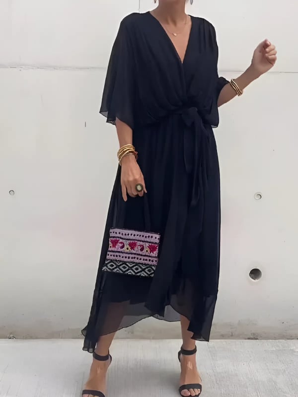Woman smiling in a wrap midi dress suitable for brunch or a casual day out