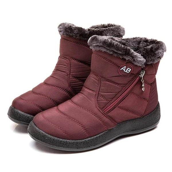 Women wearing Lori OrthoFit winter boots in gray paired with skinny jeans
