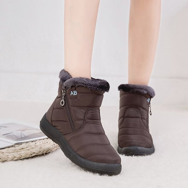 Flat lay of Lori OrthoFit winter boots in multiple color options: black, blue, brown, gray, red