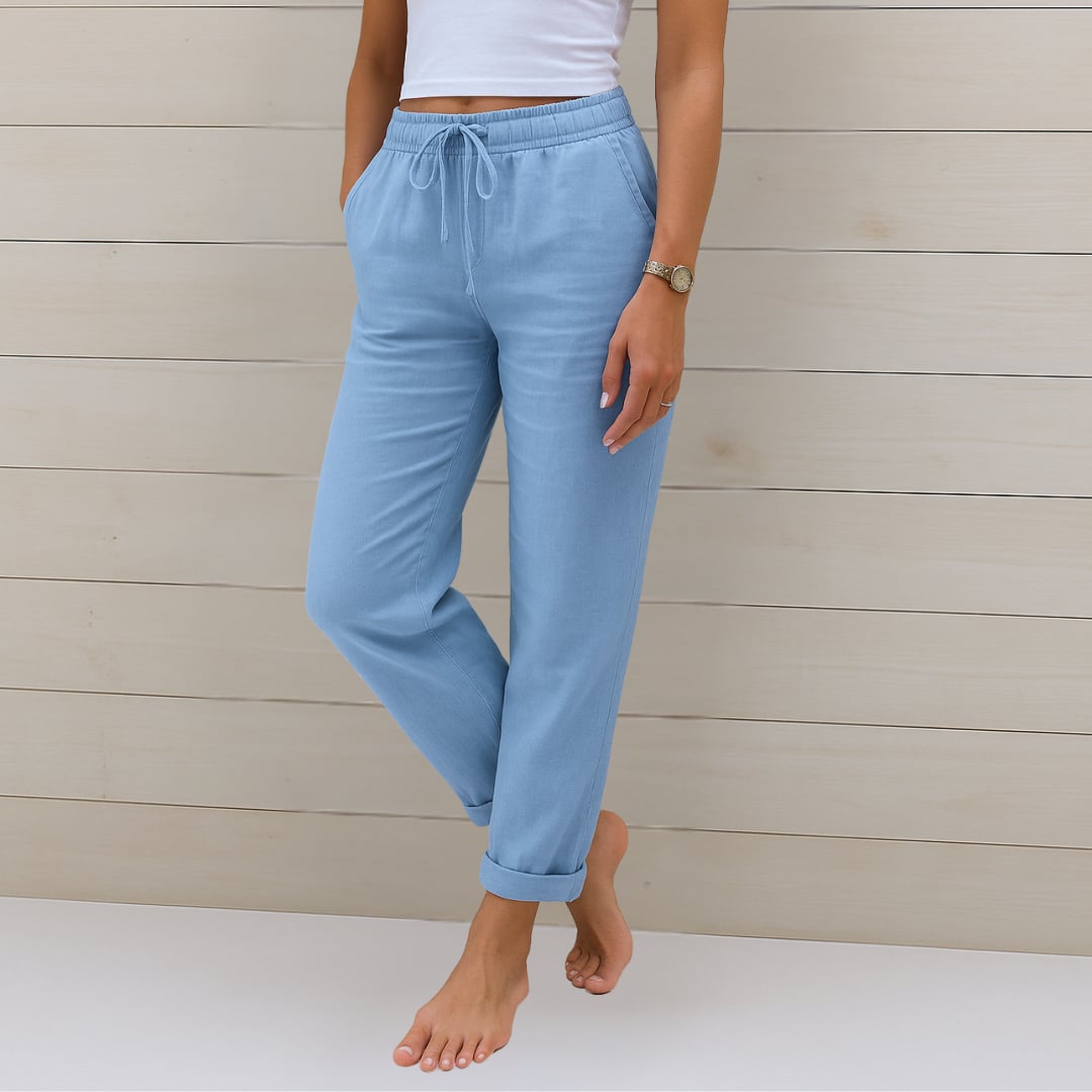Woman wearing premium breathable elastic waist pants in a relaxed fit, styled casually