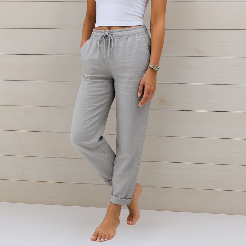 Model wearing breathable pants in a neutral color, paired with a simple top