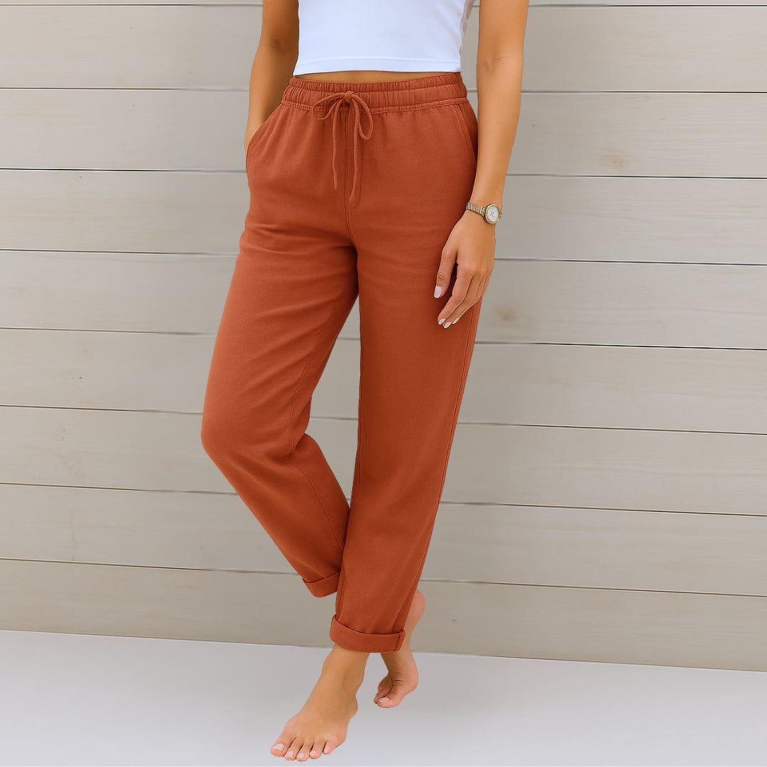 Breathable pants laid flat showing fabric texture and relaxed cut