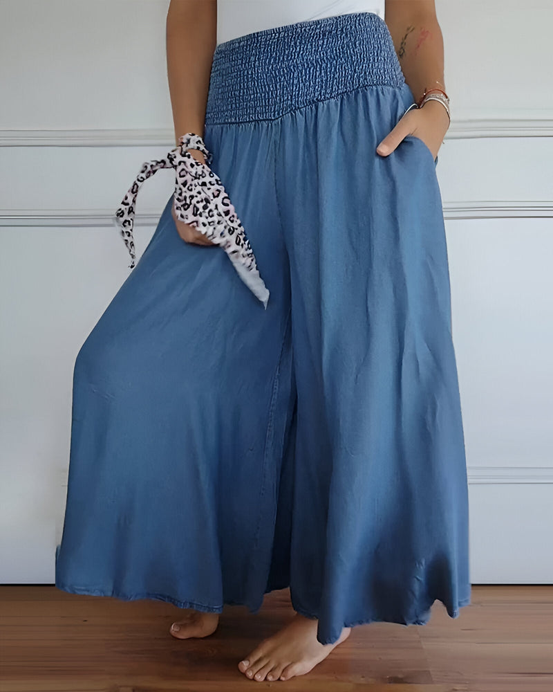 Woman in Lorraine gray comfortable pants styled with a casual top, side view