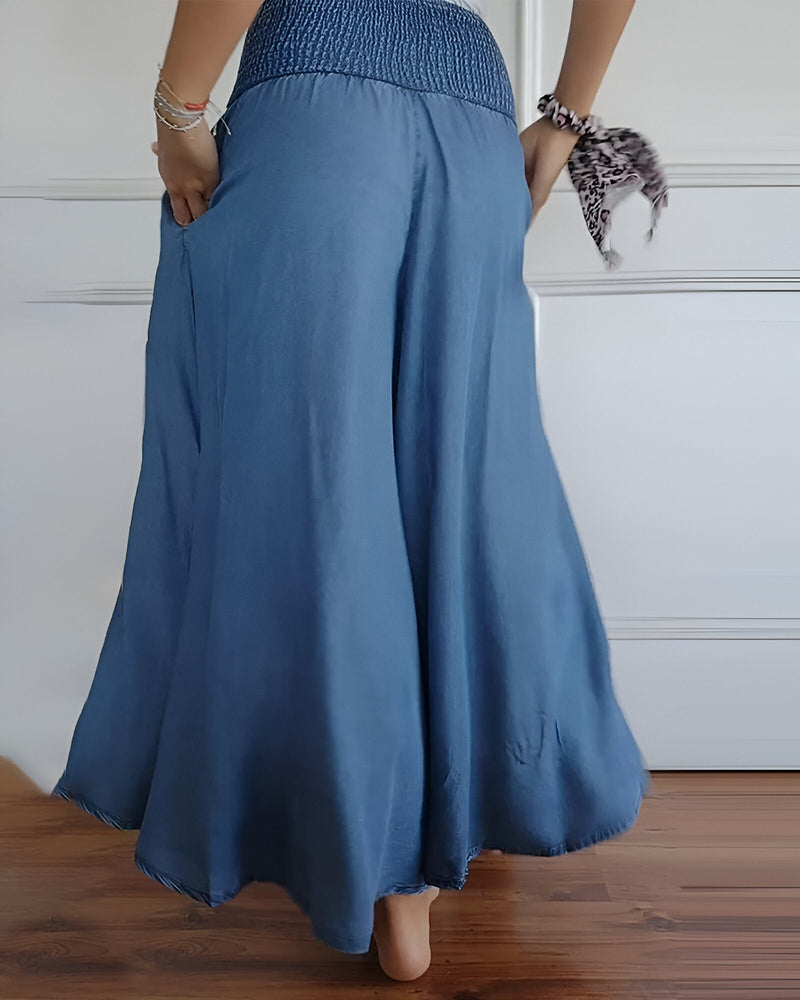 Lorraine pants in blue laid flat showing lightweight breathable fabric and clean silhouette