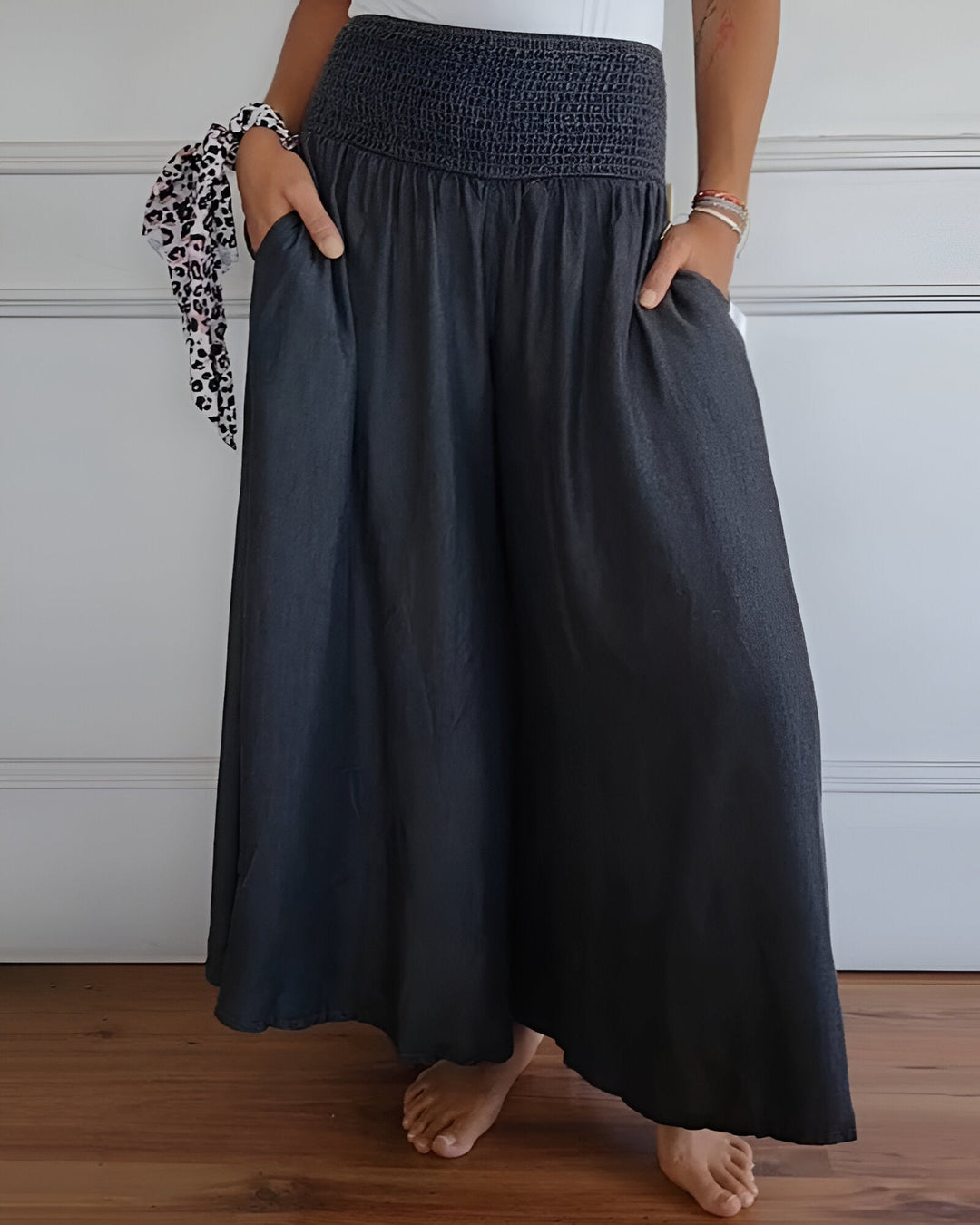 Woman walking in Lorraine elastic waist pants in gray, showcasing ease of movement