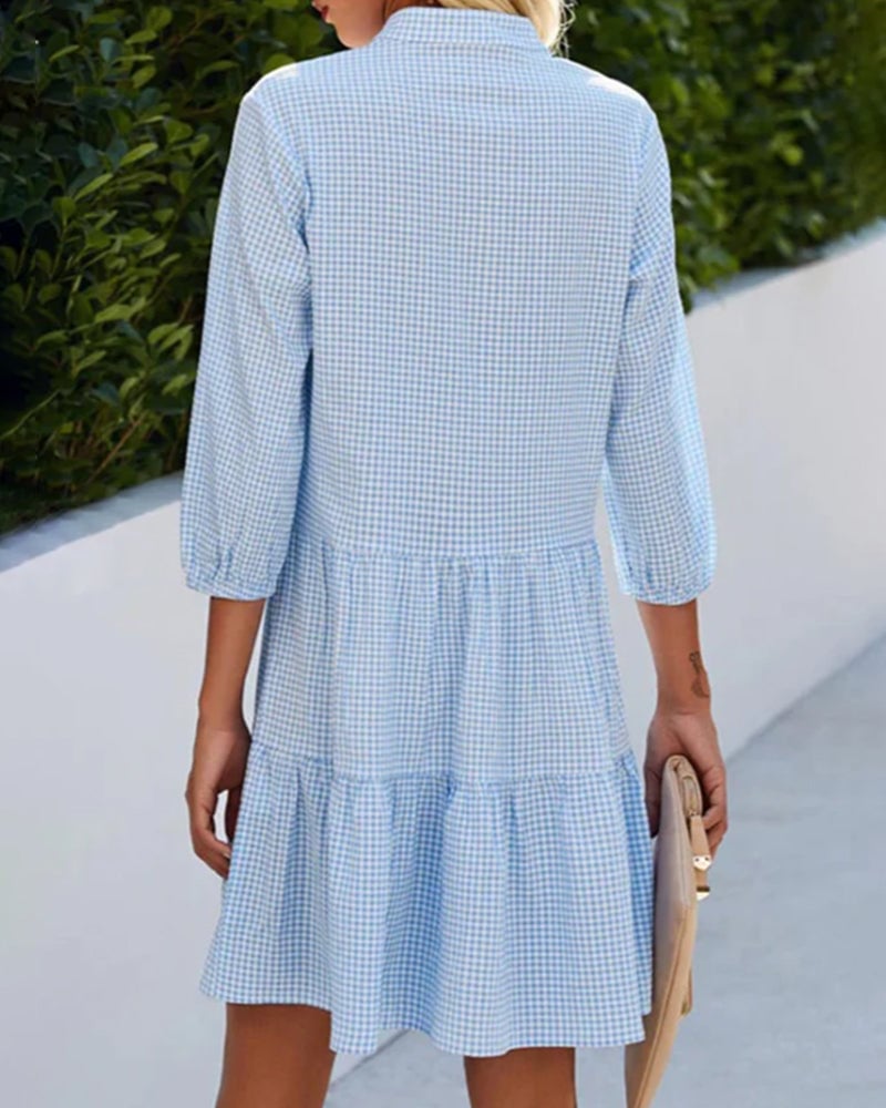 Detail view of the check print and button placket on the Lorraine Summer Check Dress in blue