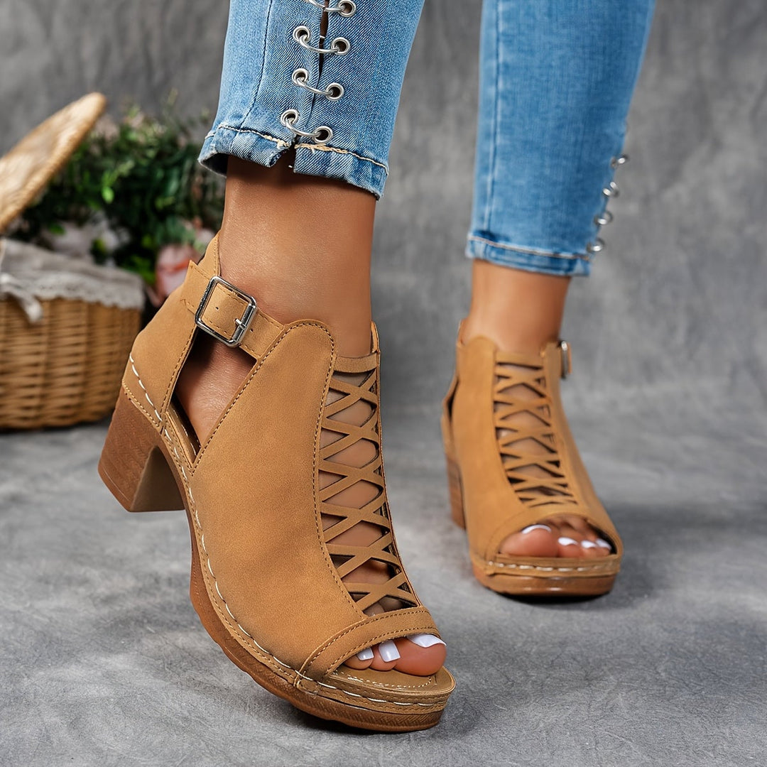 Overhead flat-lay of Lotus sandals in black and light brown side by side