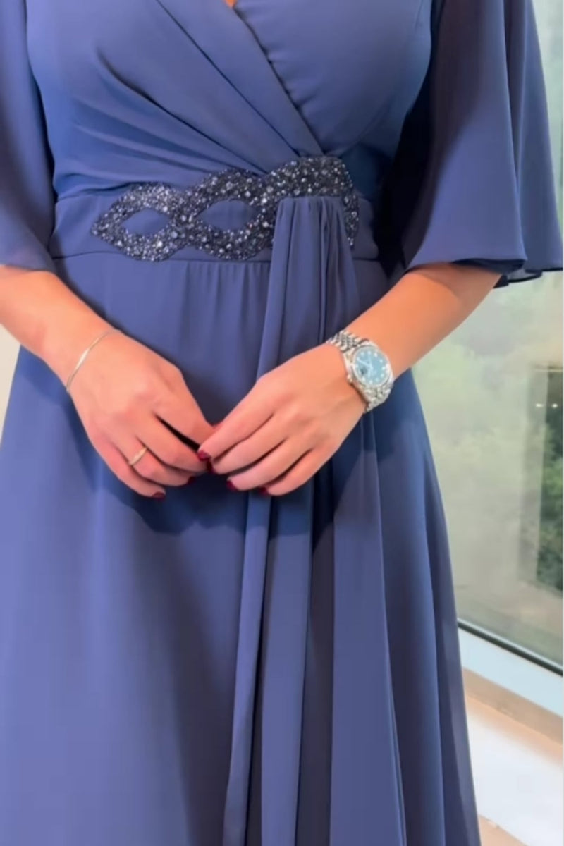 Flat lay of grey and navy V-neck maxi dresses side by side showing silhouette and length