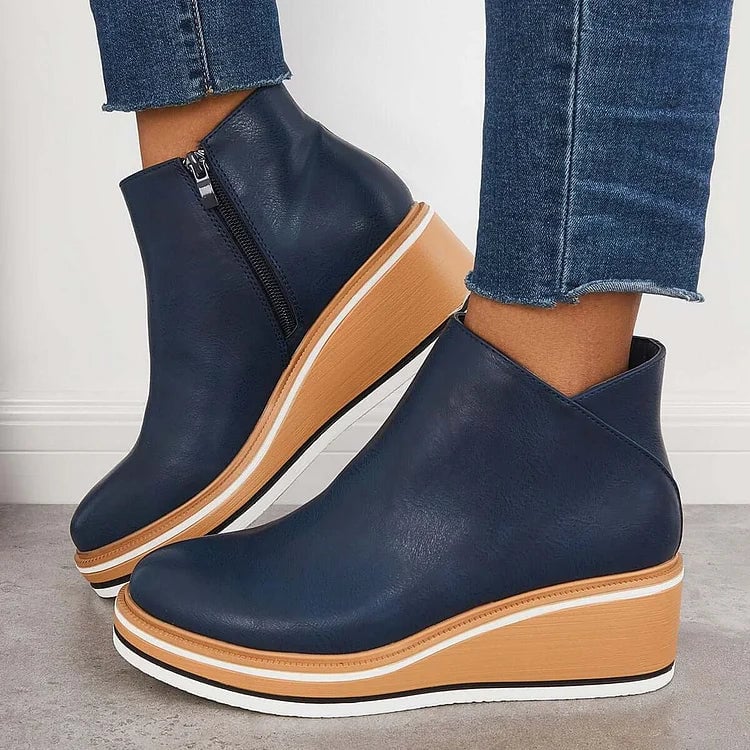 Lucille modern luxe boots in blue shown from a front three-quarter angle on a clean background