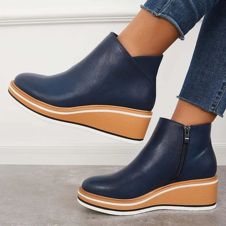 Lucille boots in beige styled with slim-fit jeans on a female model