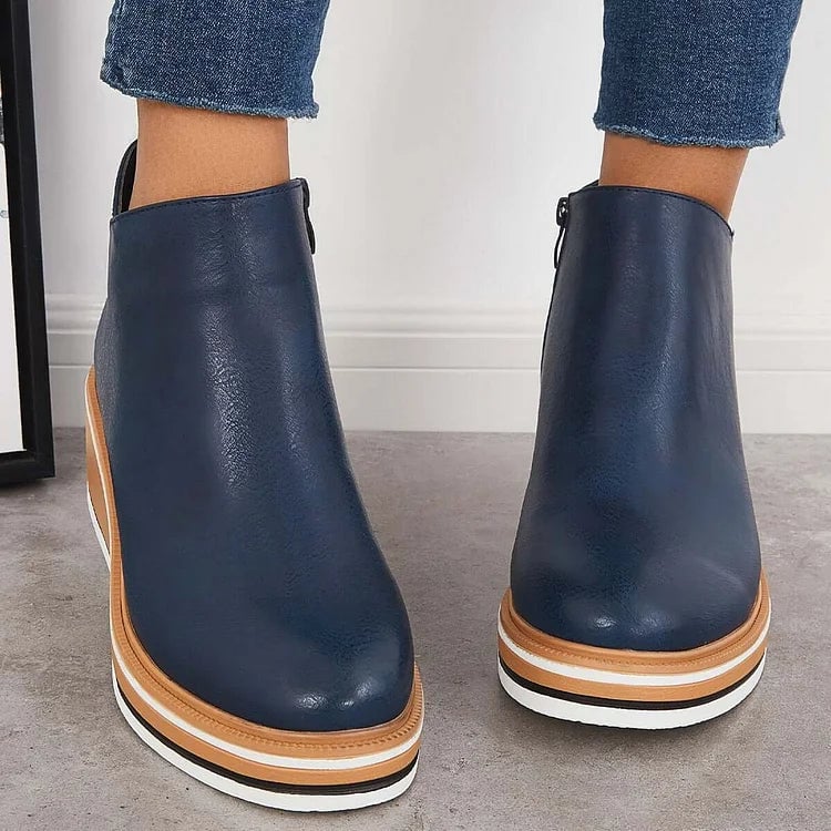 Side profile of the Lucille modern luxe boot highlighting the non-slip sole and sleek silhouette