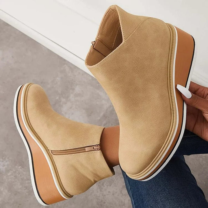 Lucille boots in black displayed on a flat surface showing toe and heel detail