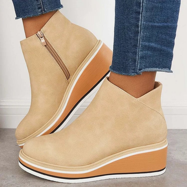 Overhead flat-lay of all four Lucille boot color options: blue, beige, black, and dark brown