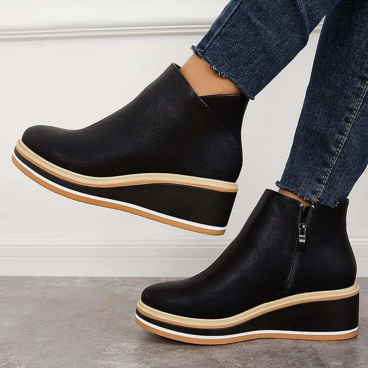 Lucille beige boots placed side by side showing consistent craftsmanship and stitching