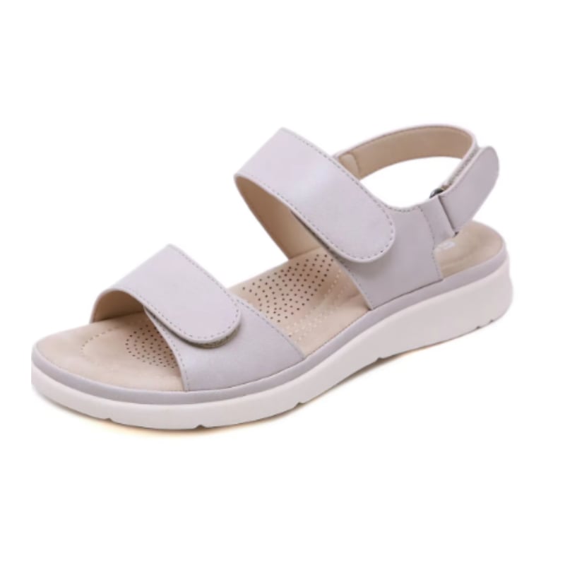 Close-up of Lucinda sandal strap hardware and cushioned insole detail