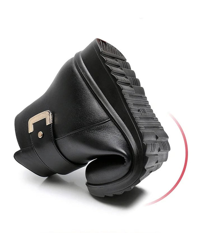 Pair of Lucy black anti-slip boots displayed on a clean neutral background