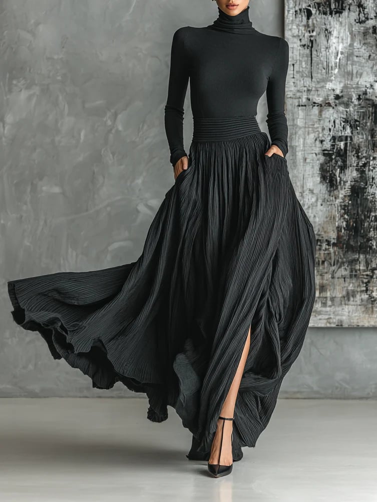 Front view of a black slim-fit turtleneck paired with a flowing pleated midi skirt on a model