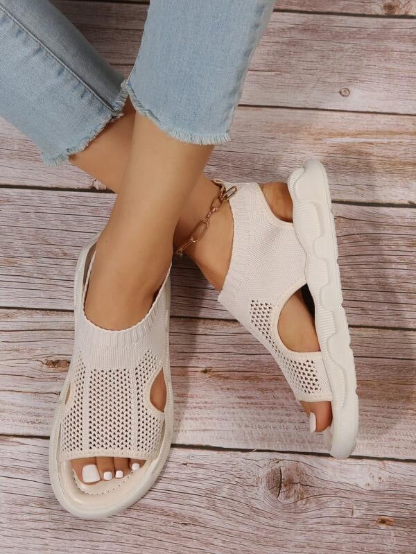Side view of Luna slip-on platform sandals in print black showing the flatform sole height