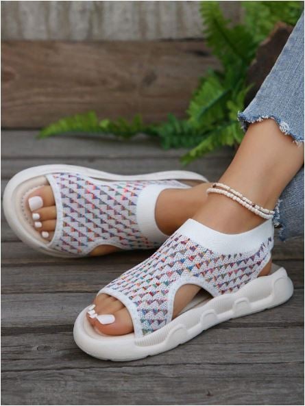 Luna print beige platform sandals worn on feet, showcasing the stretchy knit fit