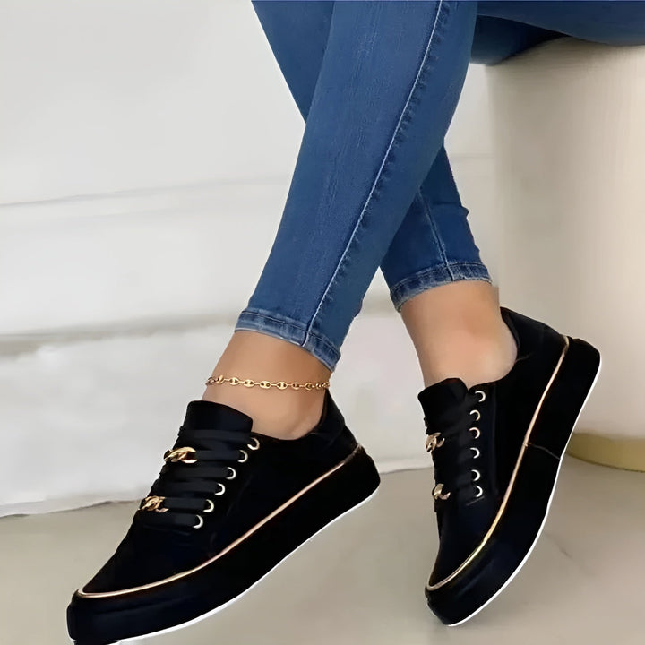 Luna platform sneaker showing gold metallic trim along the platform sole, side profile view