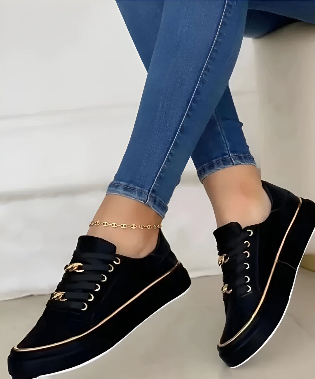 Woman wearing Luna white platform sneakers styled with light-wash jeans, lifestyle shot