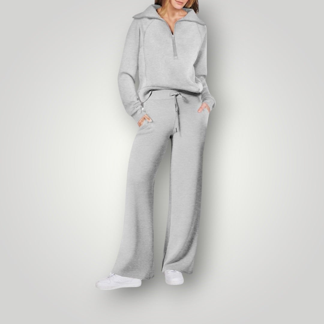 Flat lay of the Luna half-zip sweatshirt and wide-leg pants set in light green on a neutral background