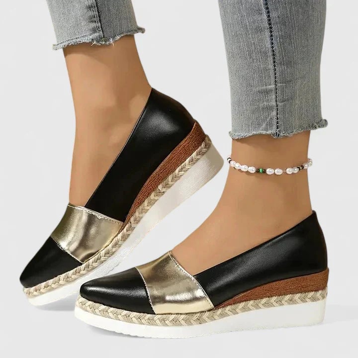 Luna dark gold metallic loafers flat lay on neutral background
