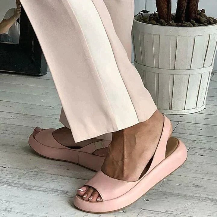 Luna slingback flat sandals styled with a summer dress on a woman