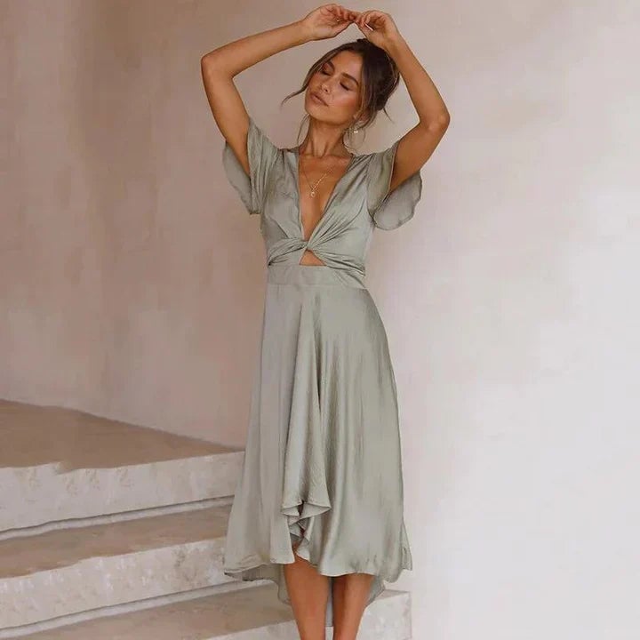 Close-up of the Luna satin midi dress tie-front detail and deep V-neckline in dusty rose