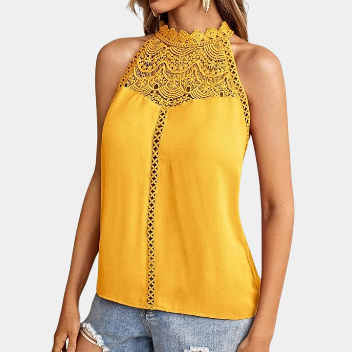 Luna lace halter mock neck top in white on model showing streamlined fit and flowing body
