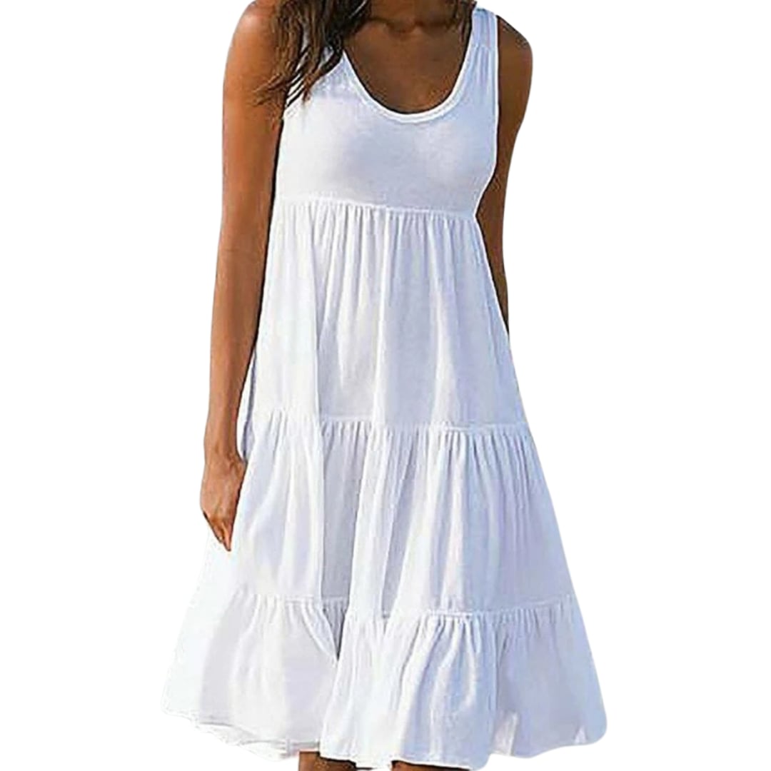 Woman wearing a white sleeveless three-tiered ruffle midi dress with a scoop neckline, standing outdoors in natural light