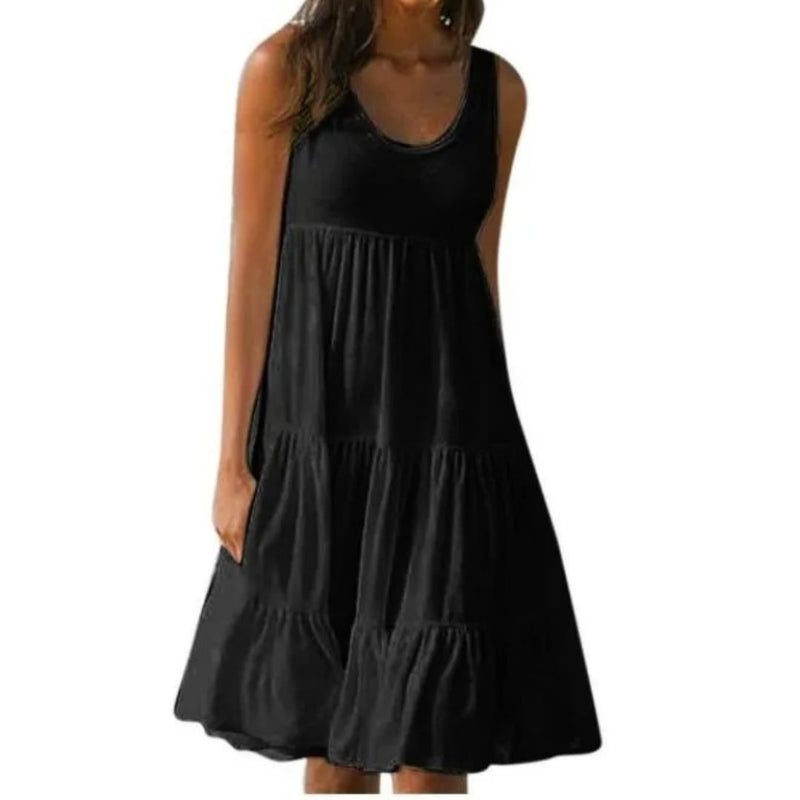 Front view of the Luna tiered midi dress in white showing the cascading ruffle layers and relaxed silhouette