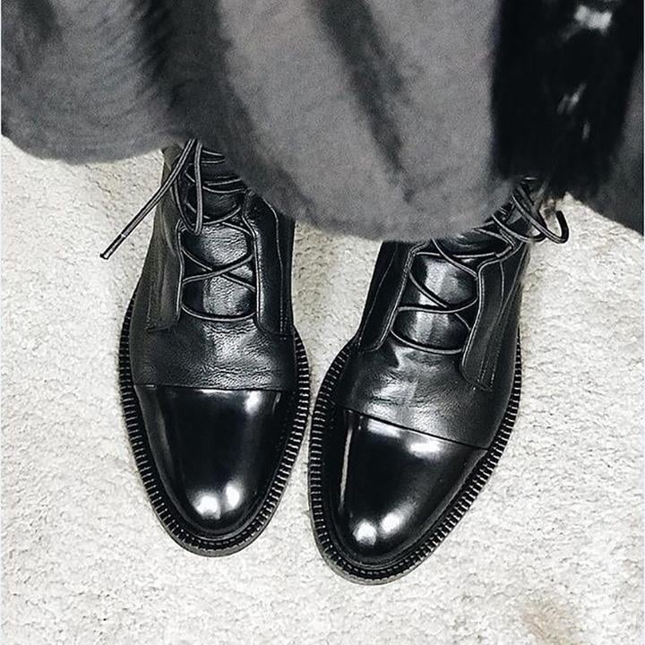 Close-up of Luna heeled boot toe and heel detail in black