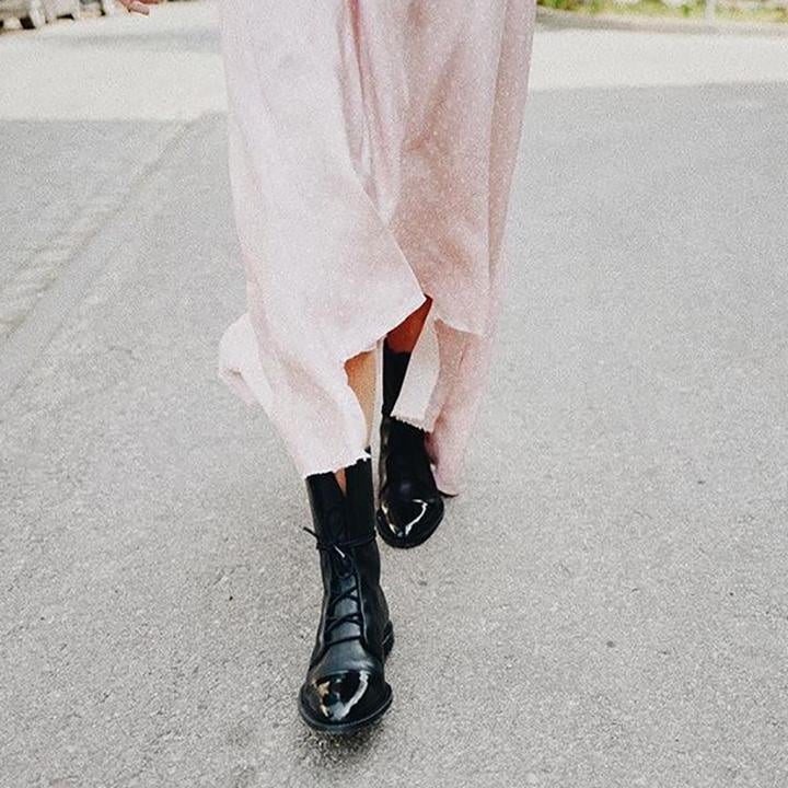 Overhead flat-lay of Luna heeled boots in both black and brown colorways
